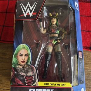WWE Action Figure with Green Hair and Black Outfit